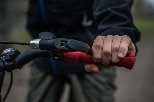 applying brakes to a bicycle